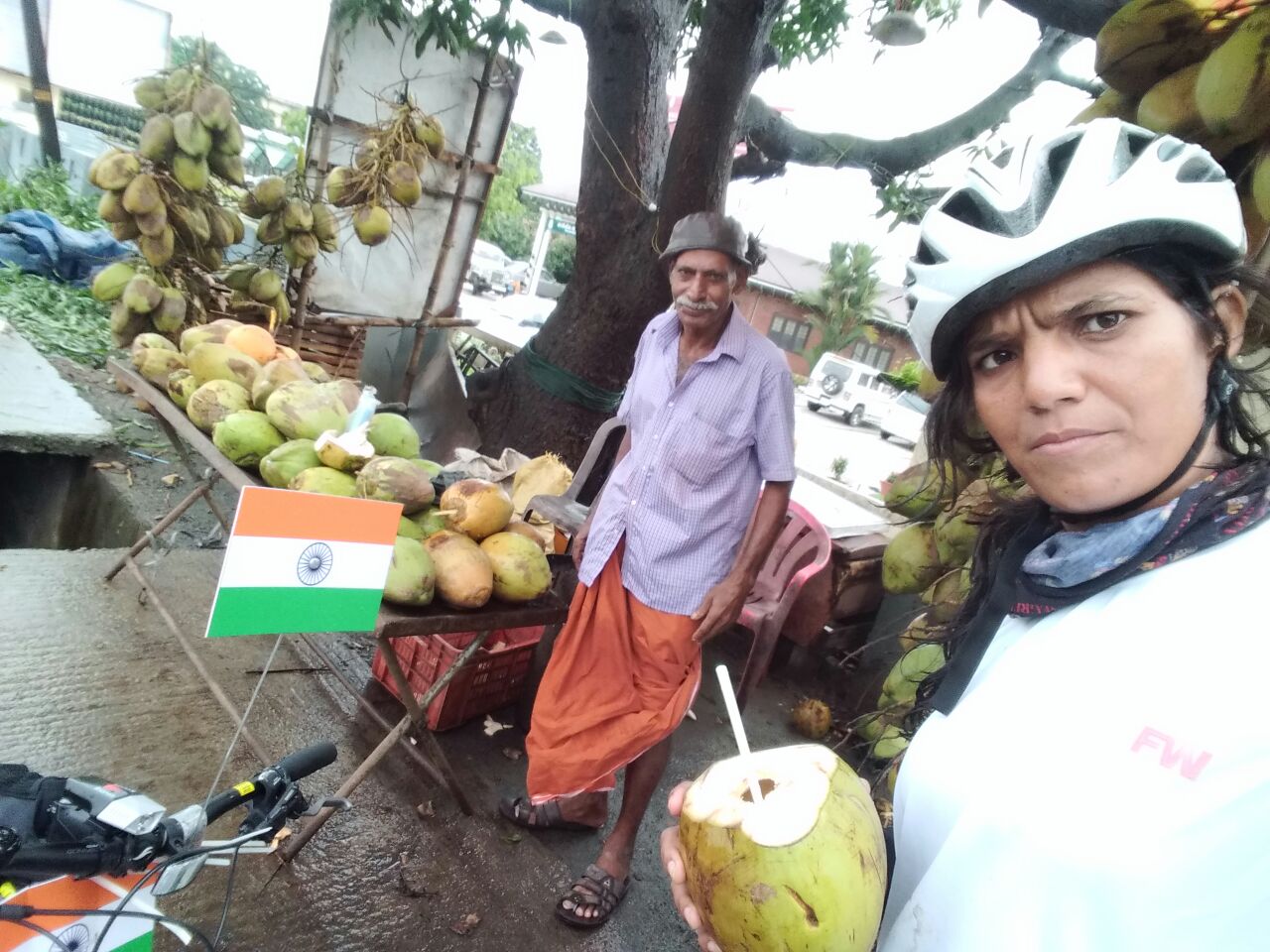 cycle expedition enjoying coconut water