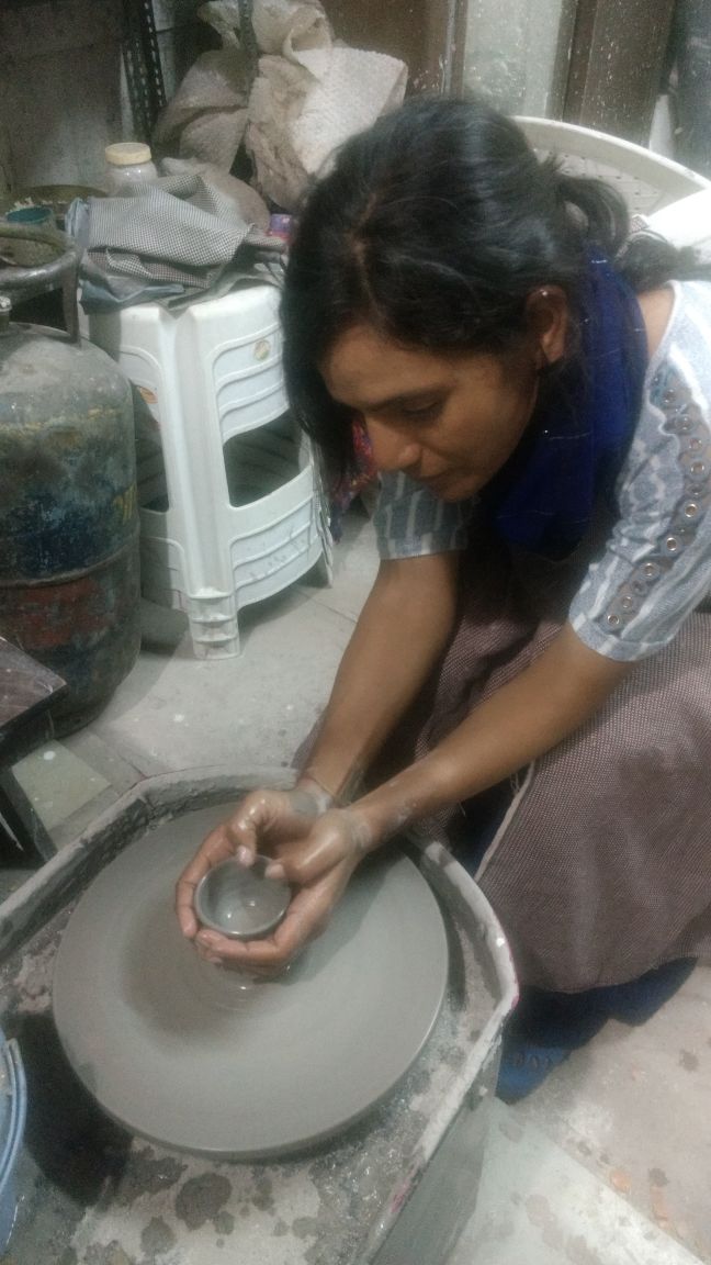 Sunita enjoying pottery